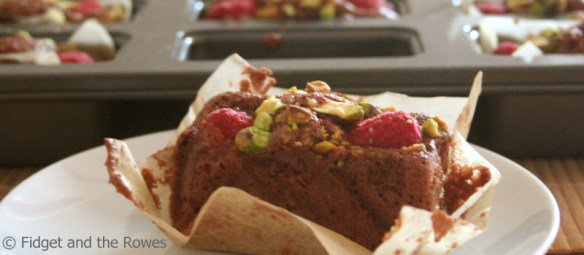 chocolate financiers with raspberries and pistachios